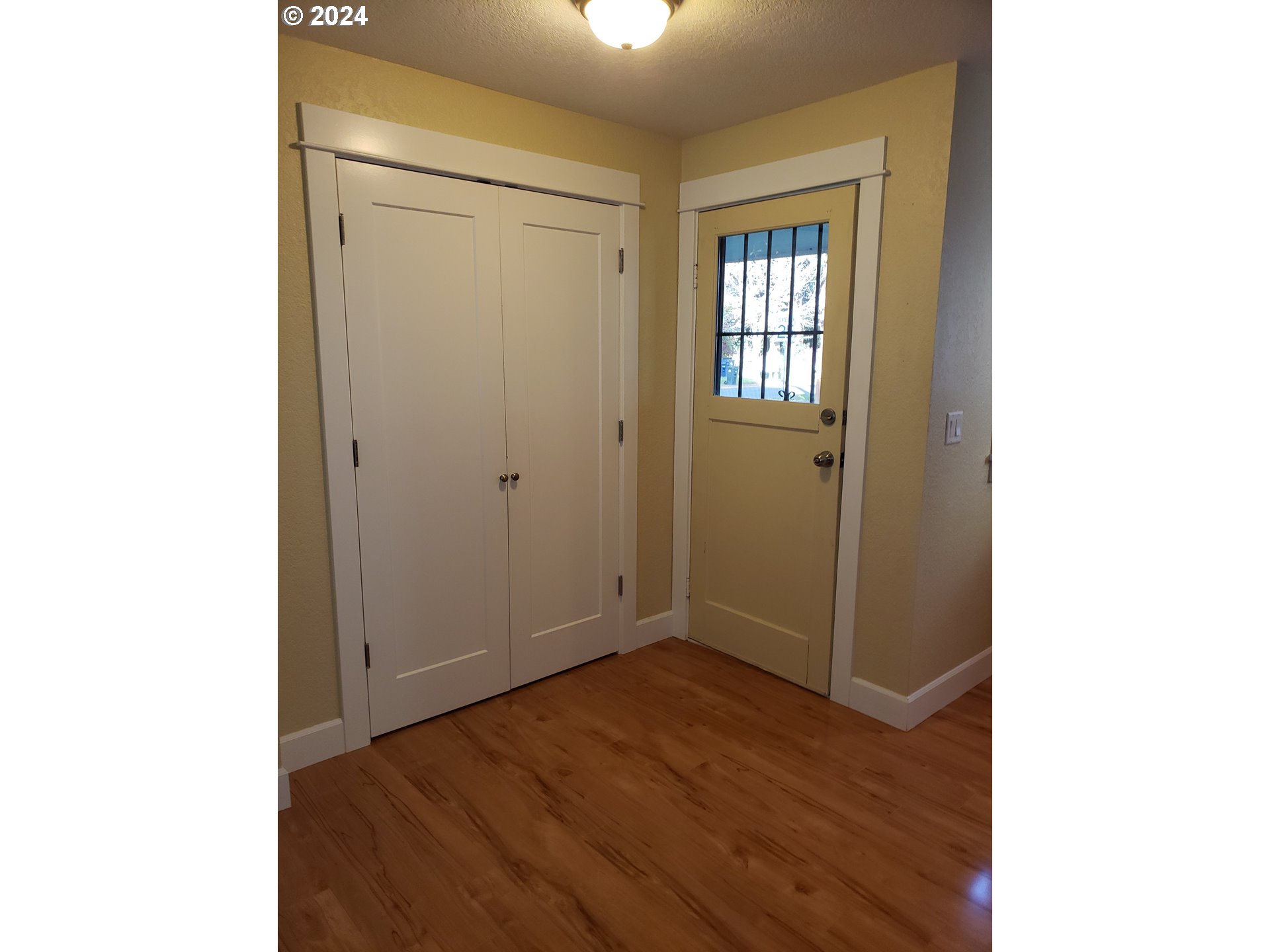 395 Irving Road Eugene, OR 97404 - Photo 10 of 37 a view of an empty room with wooden floor