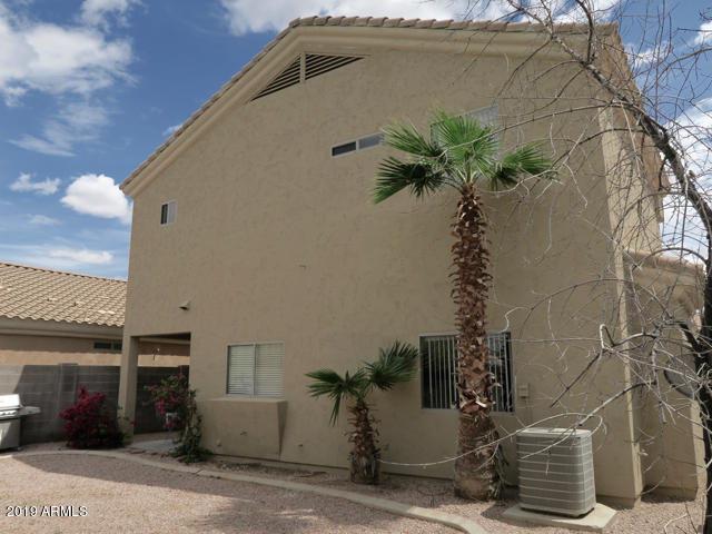 10442 East Butte Street Apache Junction, AZ 85120 - Photo 15 of 49 a picture of a building with a yard