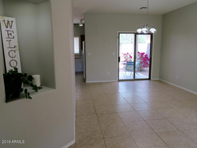 10442 East Butte Street Apache Junction, AZ 85120 - Photo 2 of 49 a view of an entryway with wooden floor