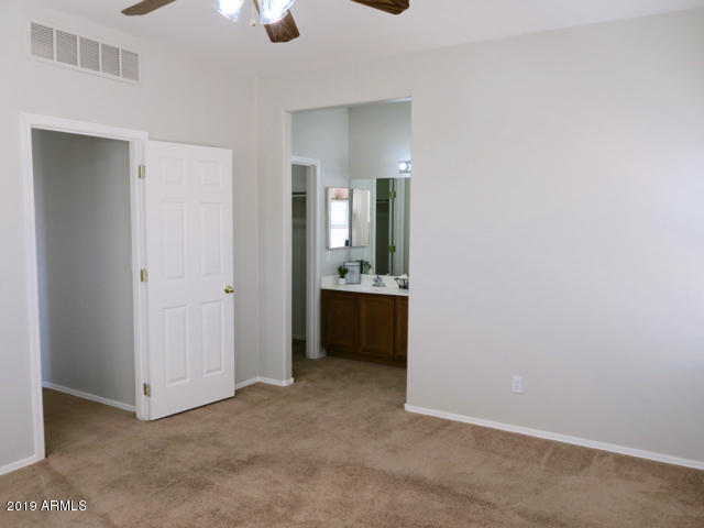 10442 East Butte Street Apache Junction, AZ 85120 - Photo 21 of 49 an empty room with a bathroom and a sink