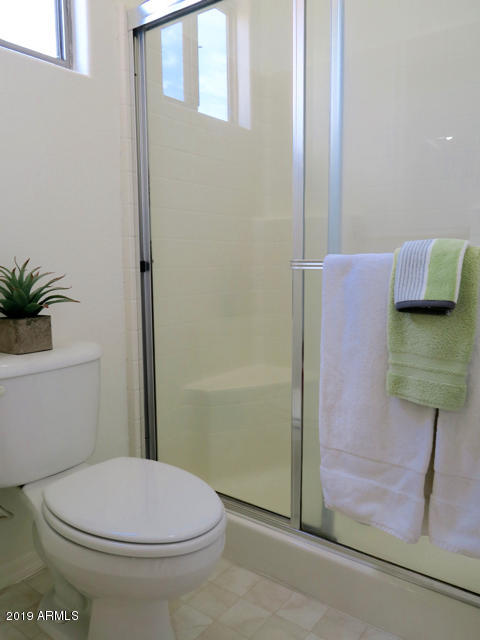 10442 East Butte Street Apache Junction, AZ 85120 - Photo 26 of 49 a bathroom with a toilet and a shower