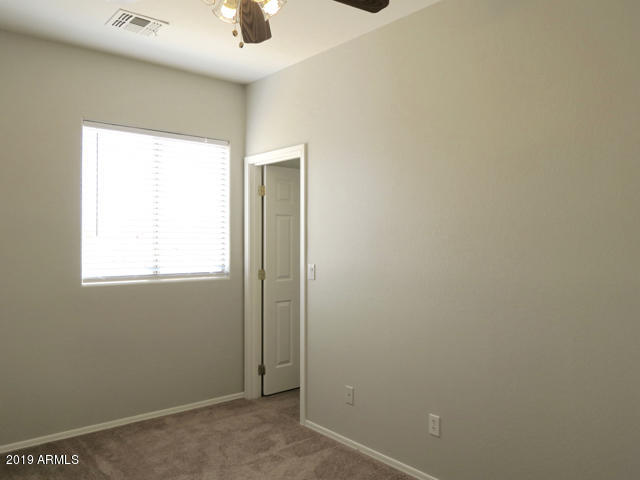 10442 East Butte Street Apache Junction, AZ 85120 - Photo 34 of 49 a view of an empty room with a window