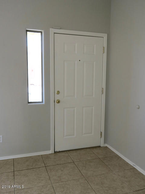 10442 East Butte Street Apache Junction, AZ 85120 - Photo 9 of 49 an empty room with window