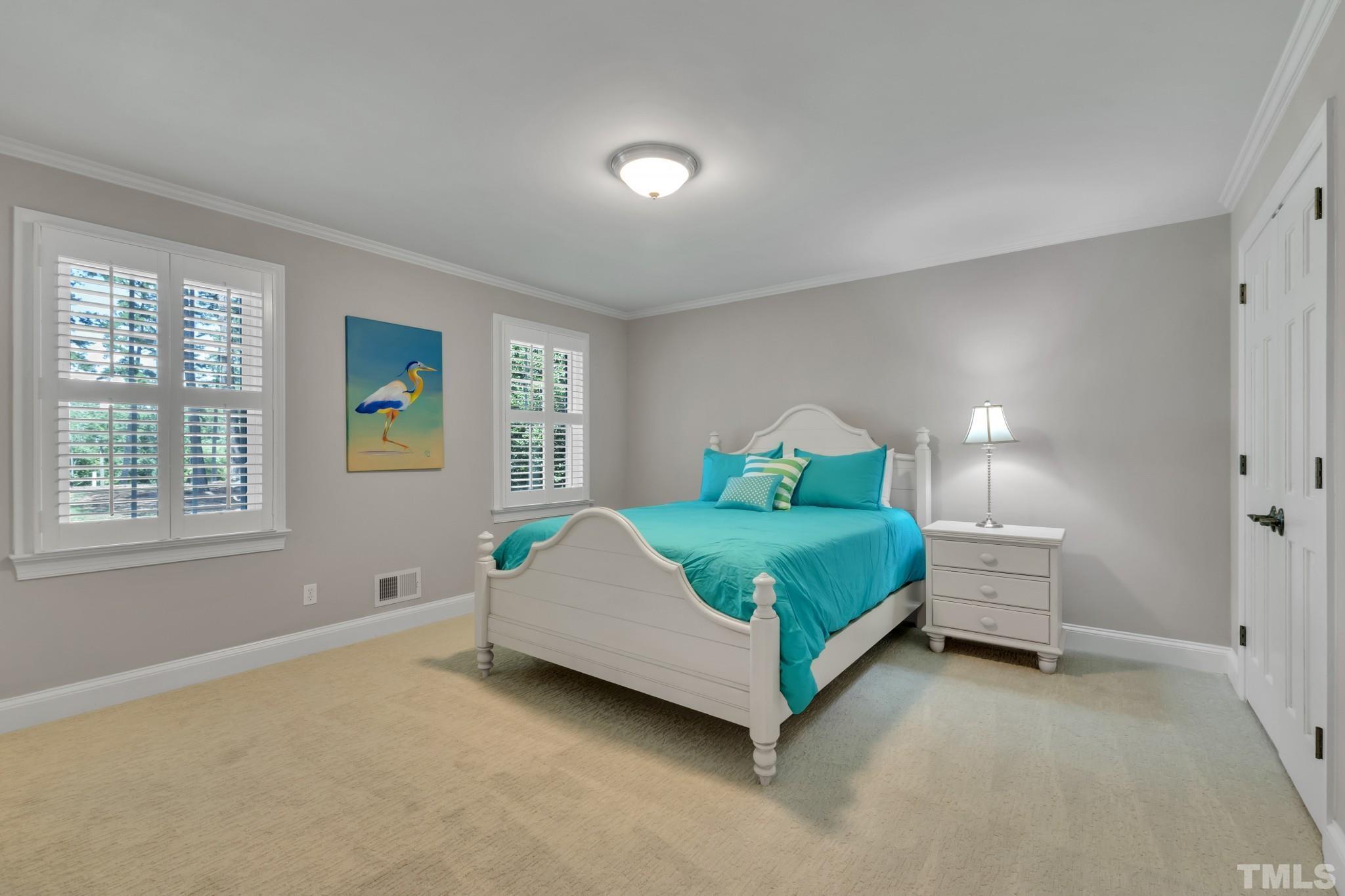 1617 Hunting Ridge Road Raleigh, NC 27615 - Photo 14 of 31 a bedroom with a bed and window