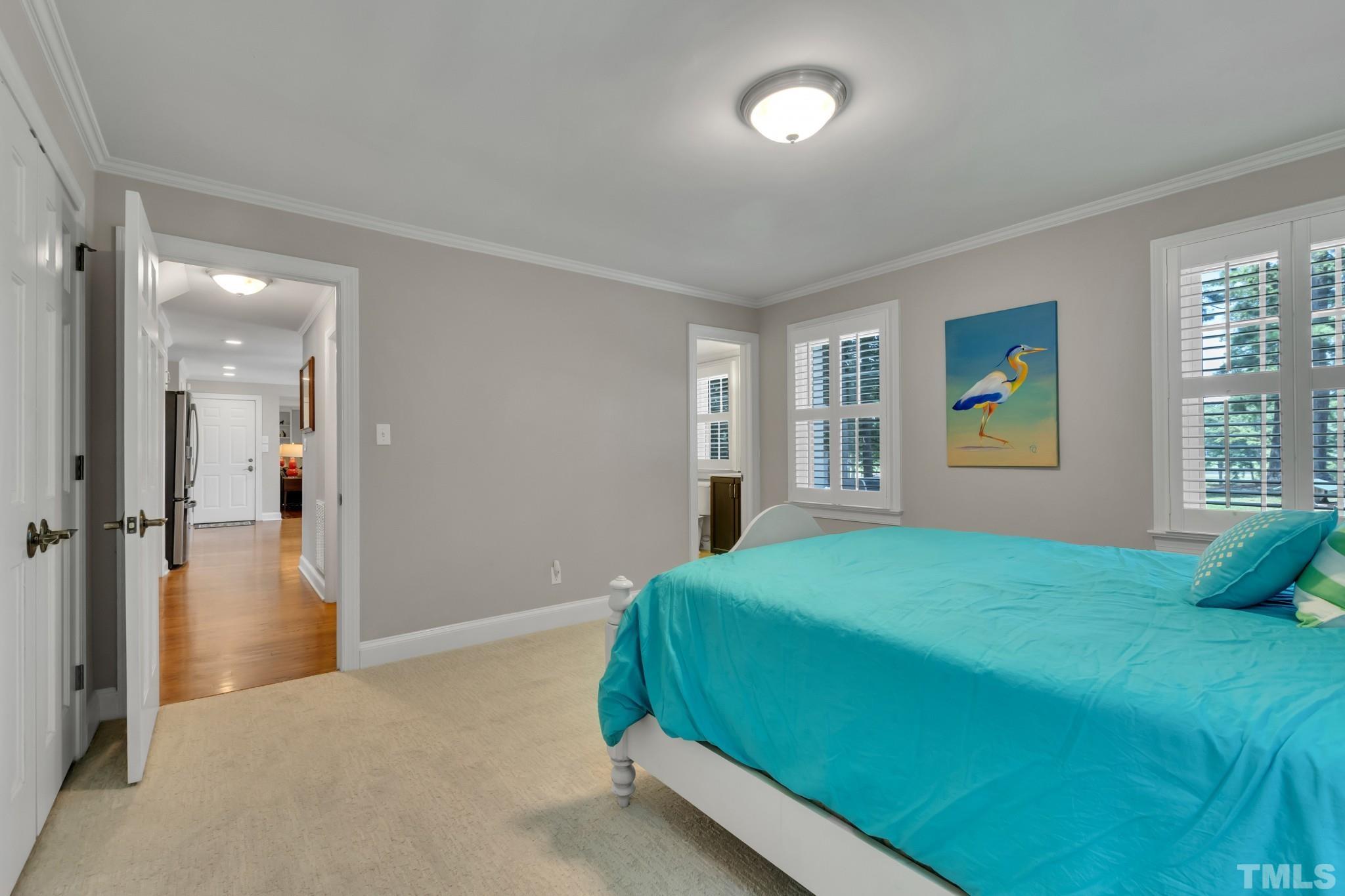 1617 Hunting Ridge Road Raleigh, NC 27615 - Photo 15 of 31 a bedroom with a bed and a window