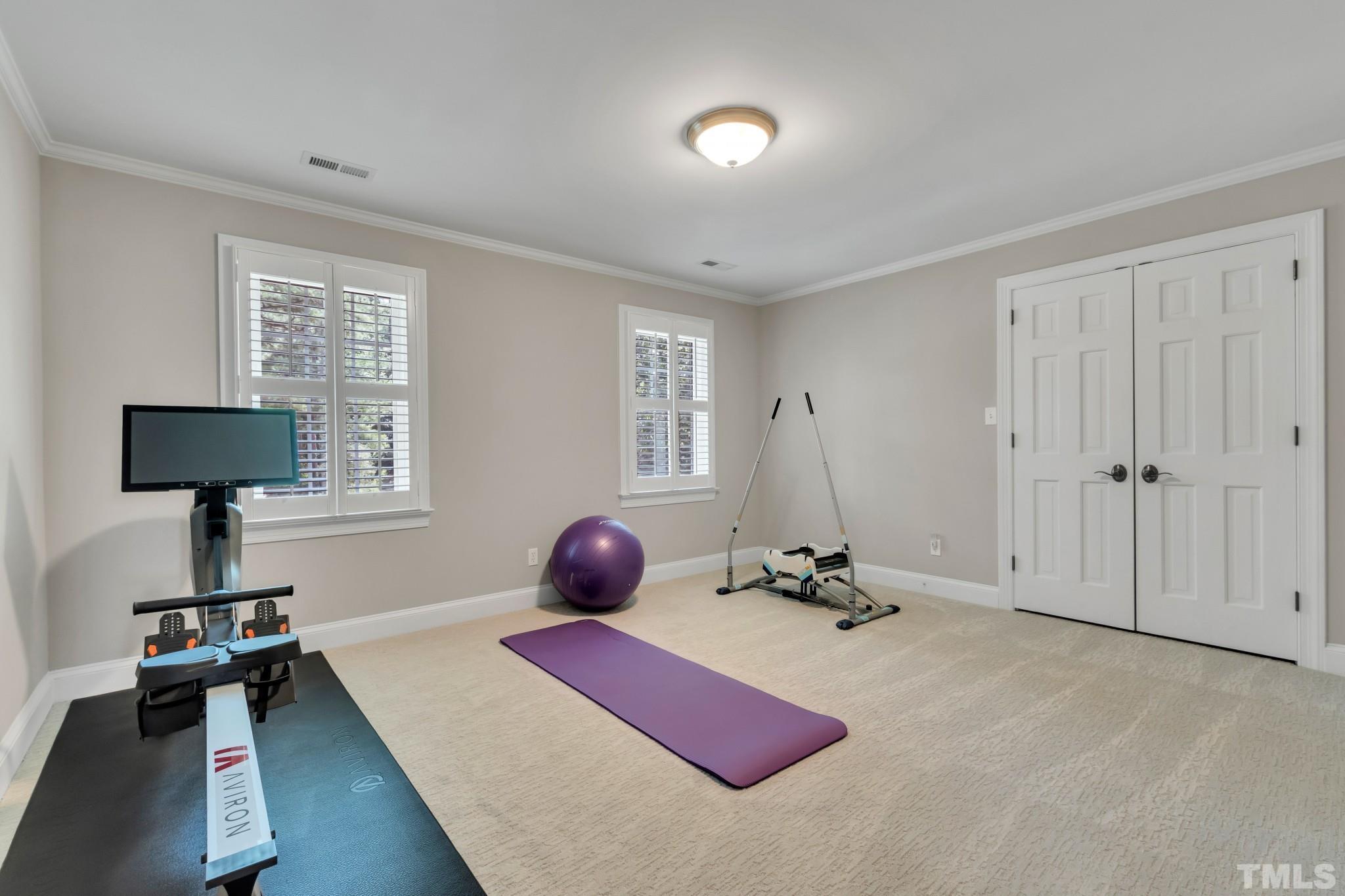 1617 Hunting Ridge Road Raleigh, NC 27615 - Photo 17 of 31 a room with a window and a table