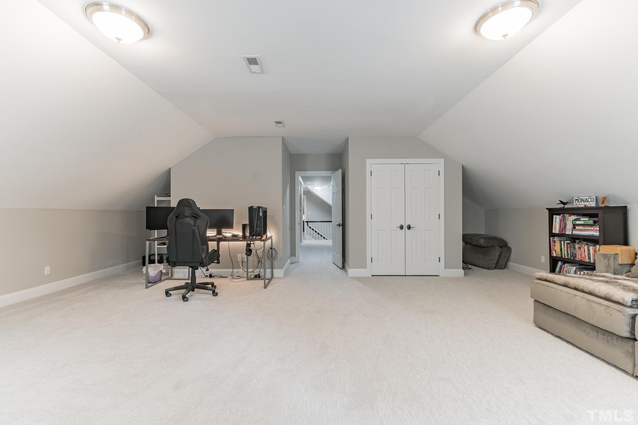 1617 Hunting Ridge Road Raleigh, NC 27615 - Photo 19 of 31 a view of workspace with furniture and white cabinet