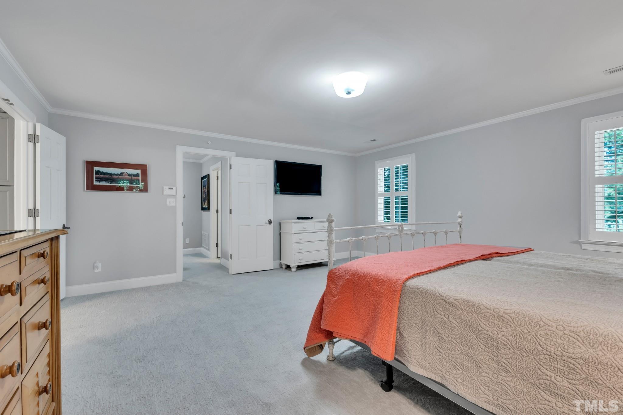 1617 Hunting Ridge Road Raleigh, NC 27615 - Photo 27 of 31 a spacious bedroom with a bed and view