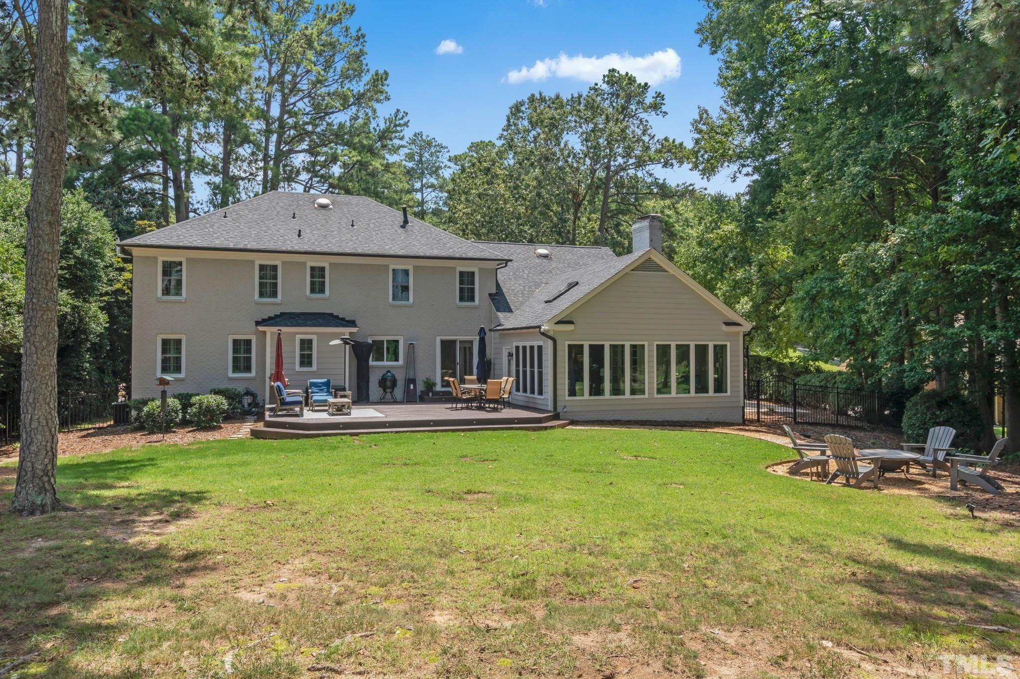 1617 Hunting Ridge Road Raleigh, NC 27615 - Photo 29 of 31 a front view of a house with garden and trees