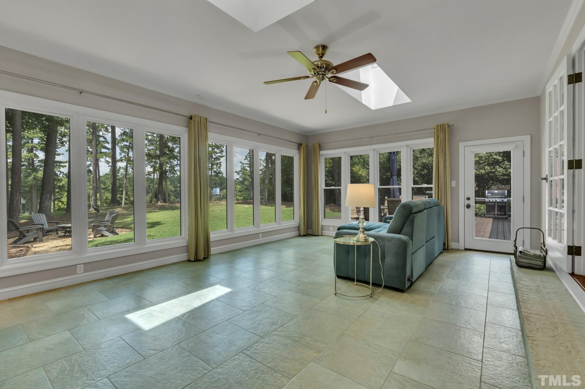 1617 Hunting Ridge Road Raleigh, NC 27615 - Photo 7 of 31 a living room with furniture and a large window