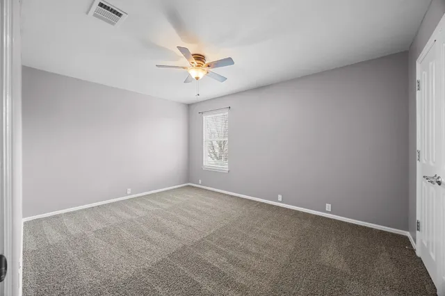 a bathroom with a double vanity sink toilet mirror and shower