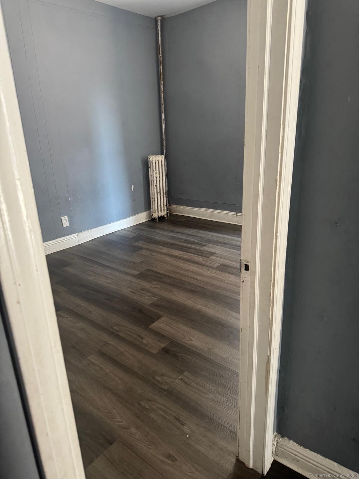 146 George Street, Unit 2 Bridgeport, CT 06604 - Photo 2 of 12 a view of empty room with wooden floor