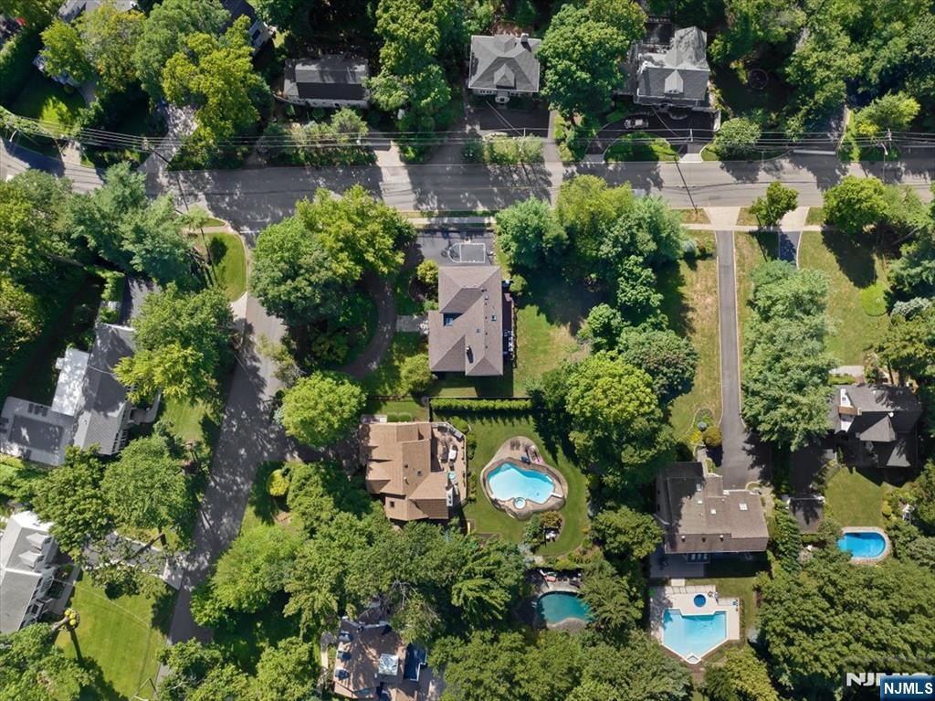 3 Forest Road Tenafly, NJ 07670 - Photo 4 of 50 an aerial view of a house with a yard and garden