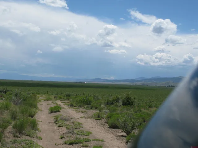 a view of a lake with a big yard