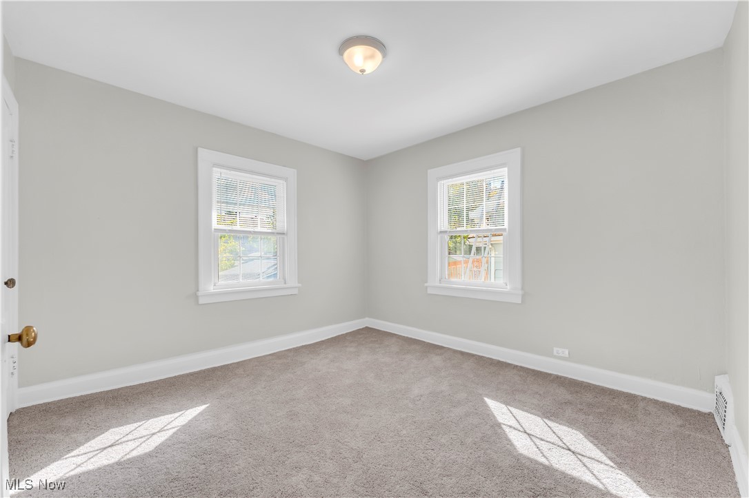 945 Nela View Road Cleveland Heights, OH 44112 - Photo 20 of 27 Spare room featuring light carpet