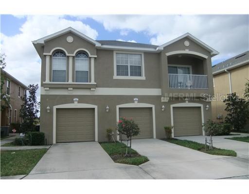 9124 Moonlit Meadows Loop Riverview, FL 33578 - Photo 1 of 1 a front view of a house with a yard and garage