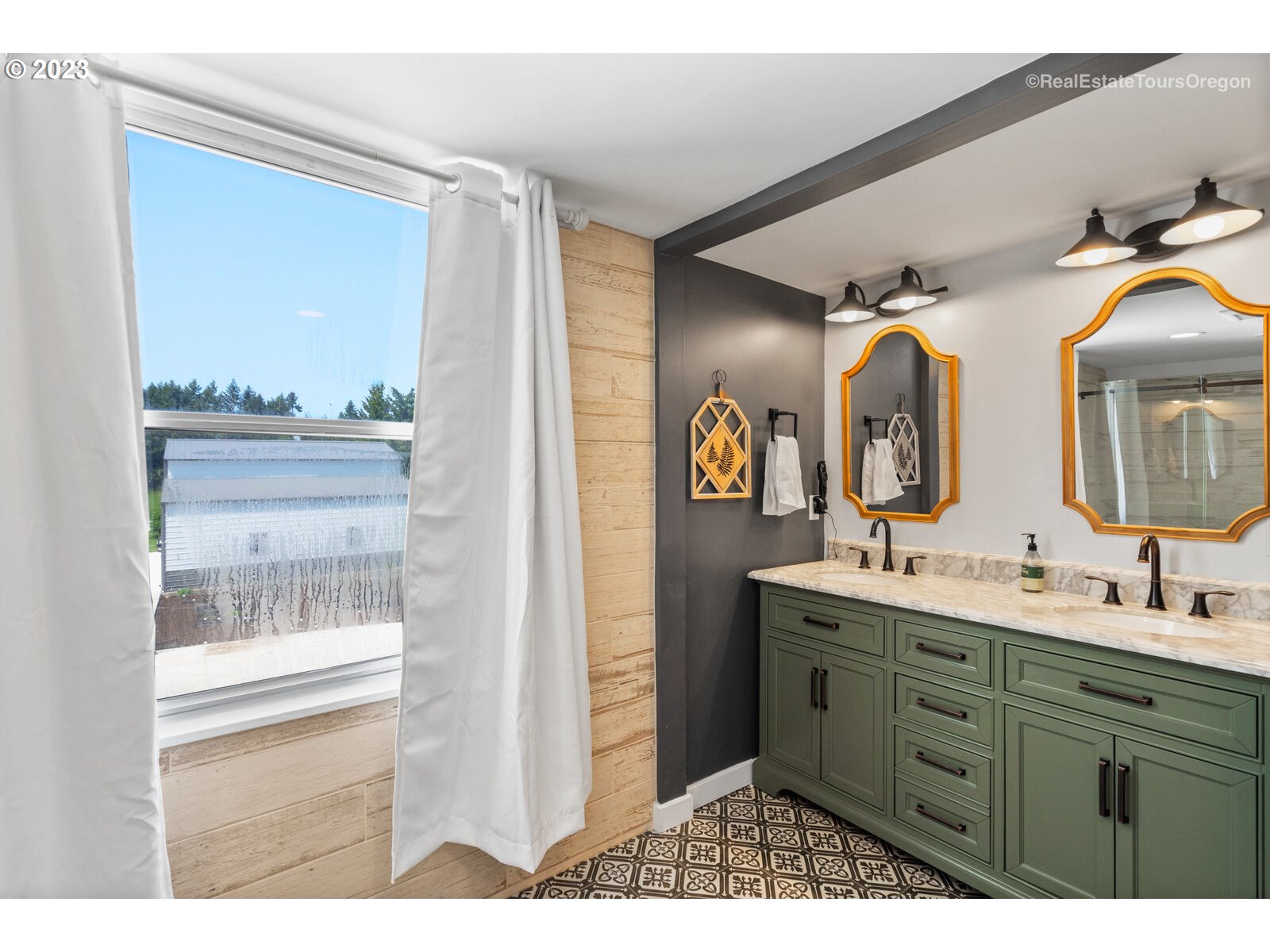 6970 South Knights Bridge Road Canby, OR 97013 - Photo 15 of 32 a bathroom with a double vanity sink and a mirror
