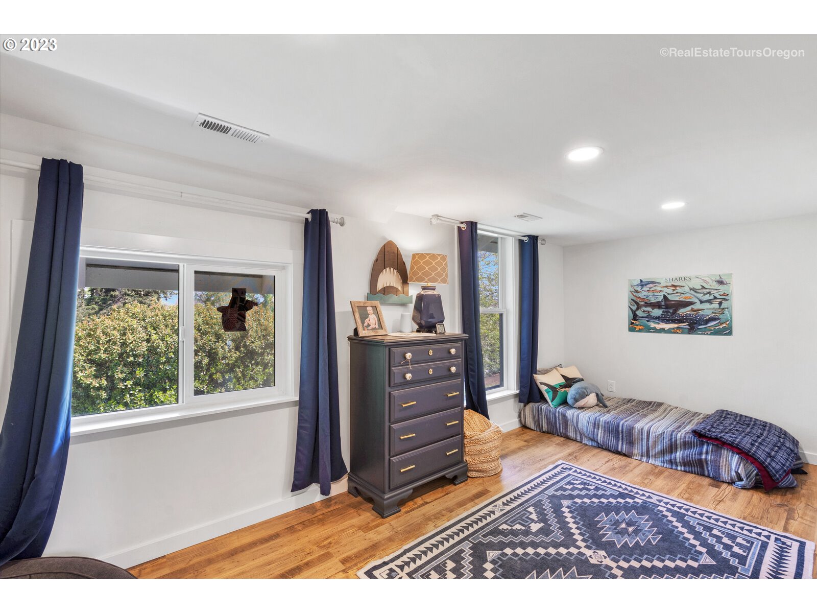 6970 South Knights Bridge Road Canby, OR 97013 - Photo 17 of 32 a view of a bedroom with furniture and window