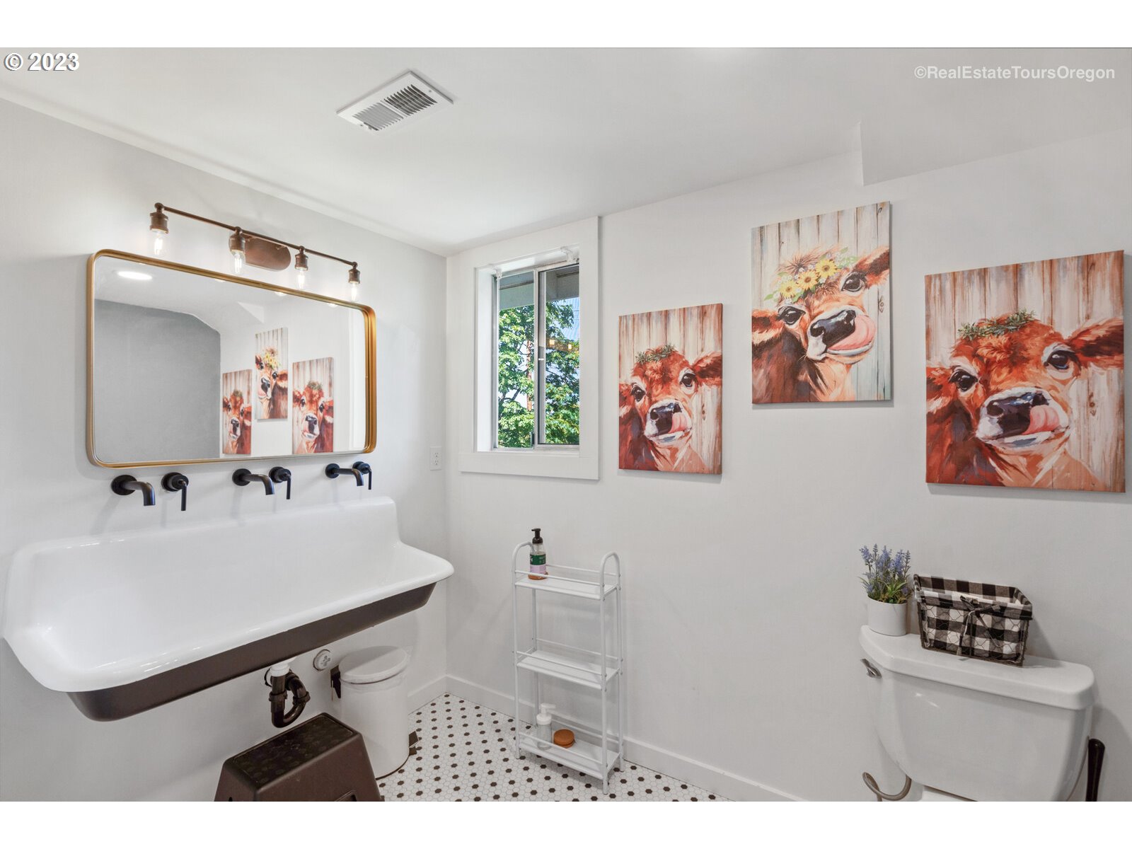 6970 South Knights Bridge Road Canby, OR 97013 - Photo 22 of 32 a bathroom with a sink mirror and a picture on the wall