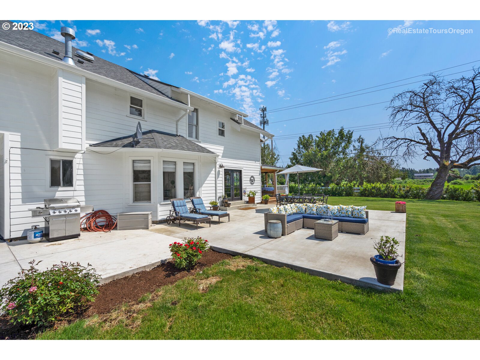 6970 South Knights Bridge Road Canby, OR 97013 - Photo 27 of 32 a view of a house with backyard porch and sitting area