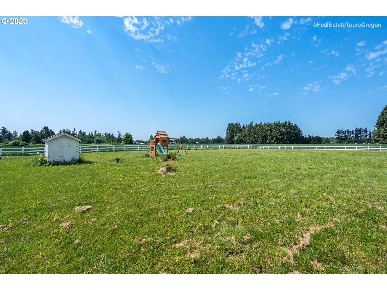 6970 South Knights Bridge Road Canby, OR 97013 - Photo 29 of 32 a view of a golf course with a lake