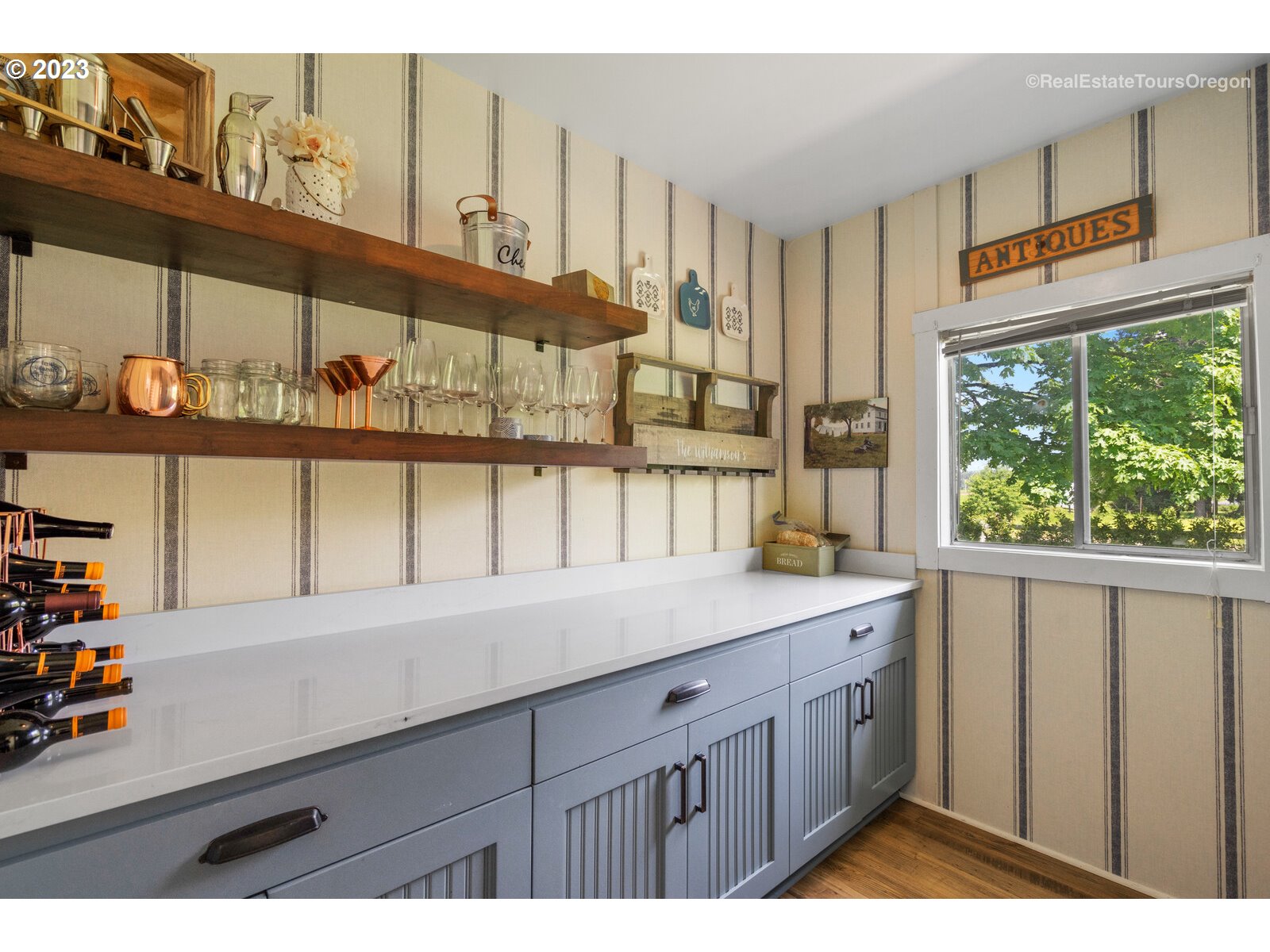 6970 South Knights Bridge Road Canby, OR 97013 - Photo 9 of 32 a kitchen with a sink a window and cabinets