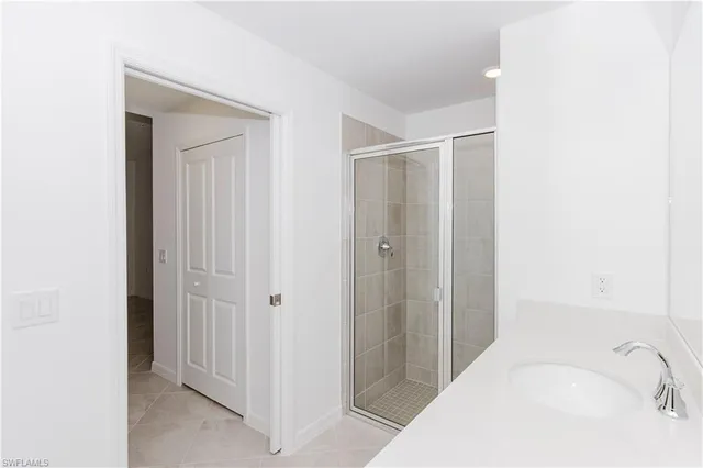 a bathroom with a sink and a shower