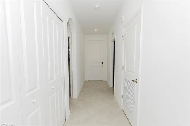 a view of a hallway with closet