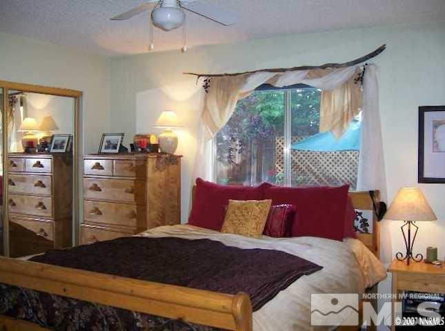 4389 Pescado Way Reno, NV 89502 - Photo 8 of 9 a bedroom with a bed and a closet