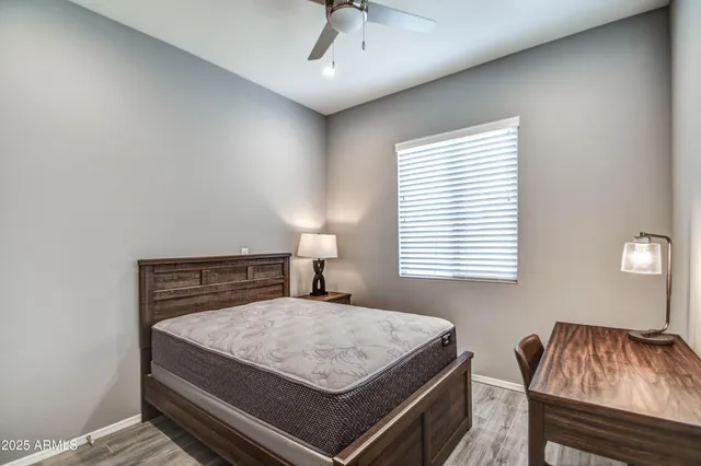 a bedroom with a bed and window