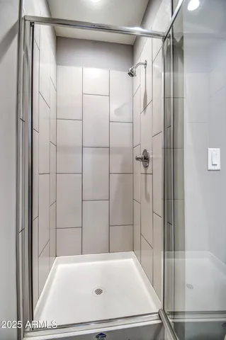 a bathroom with a tub and shower