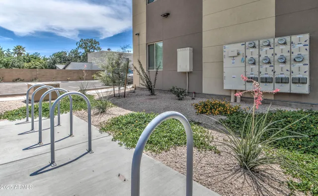 a view of a patio with a table and chairs