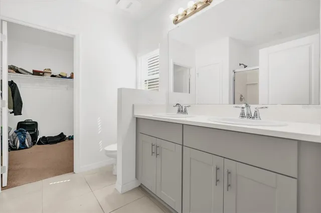 a bedroom with a bed and a chair