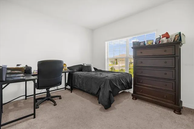 a bedroom with a bed and cabinets