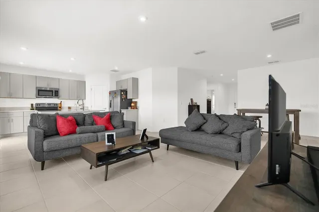 a living room with furniture and a couch