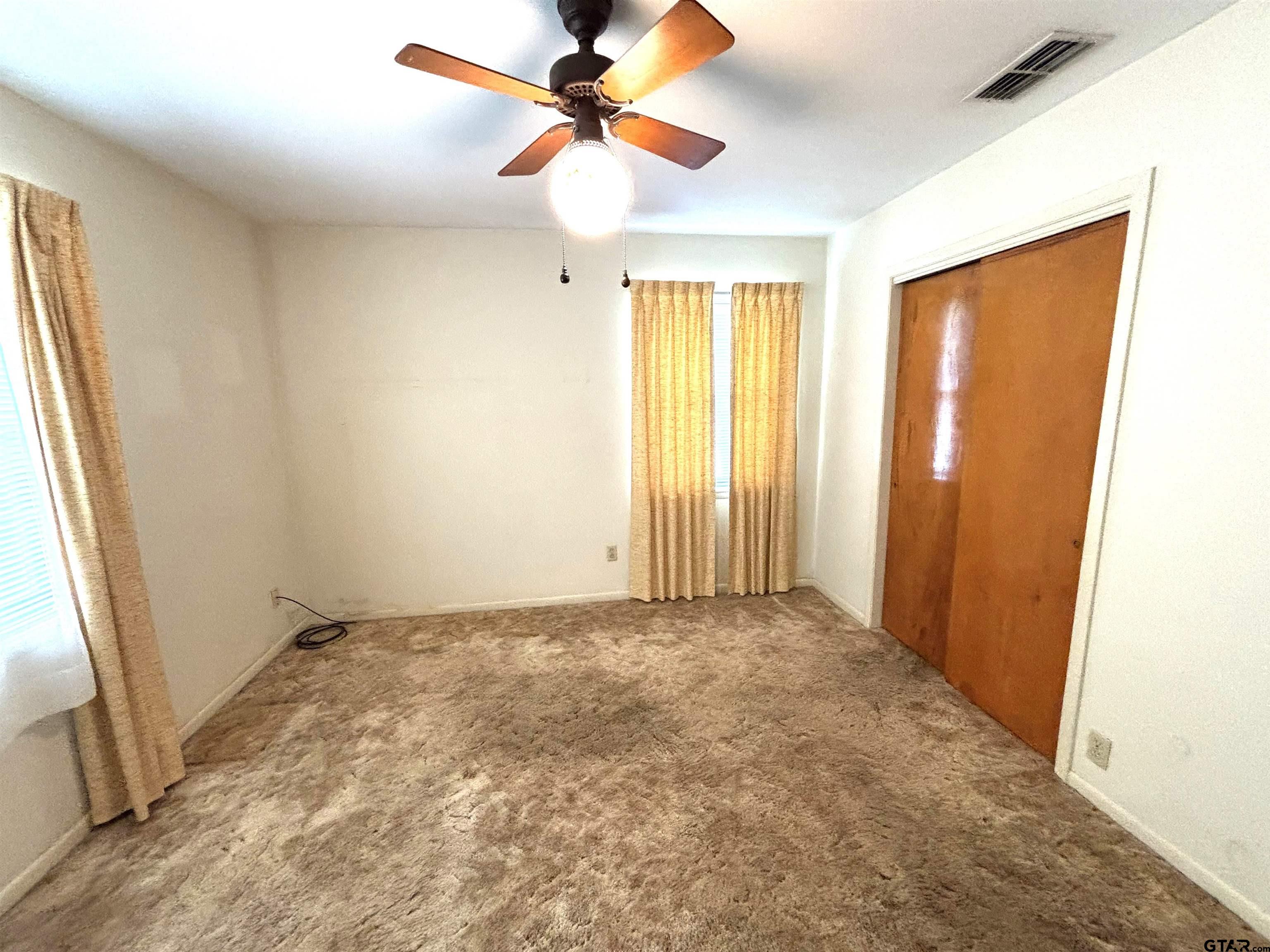 116 Clearview Drive Palestine, TX 75803 - Photo 13 of 25 a view of room with window and a ceiling fan