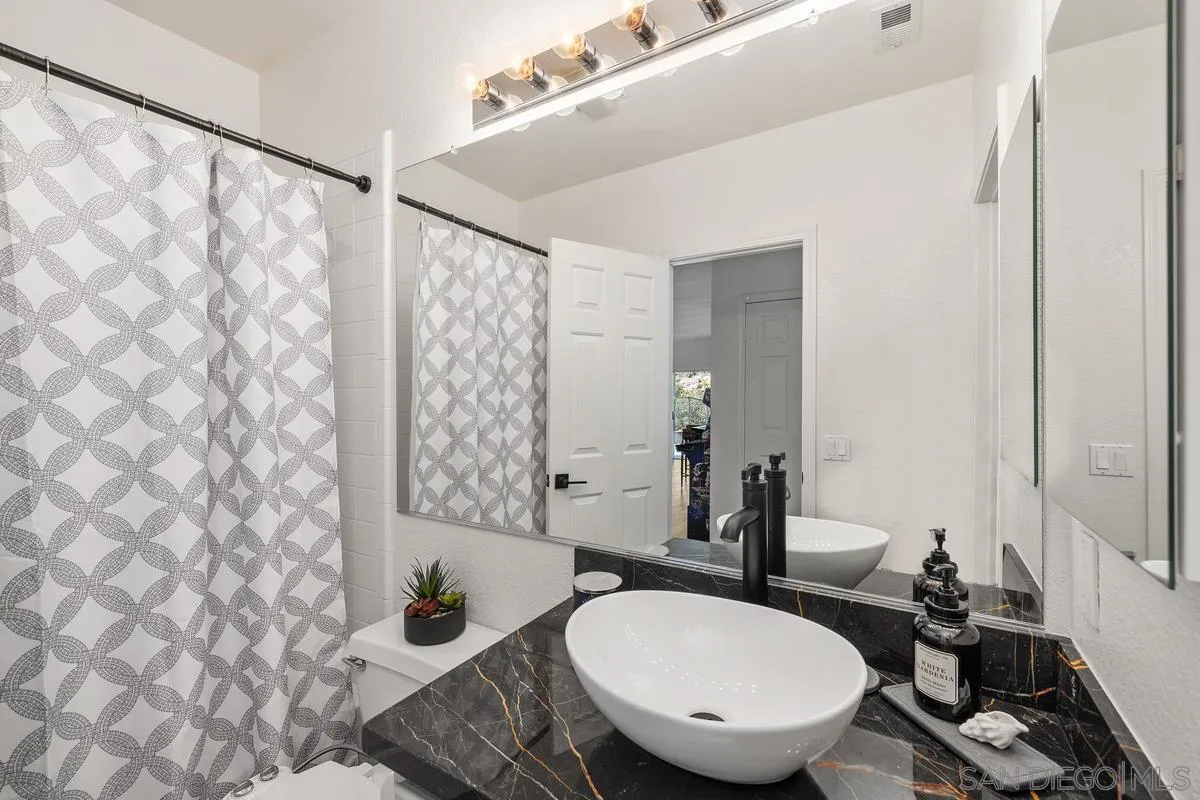 2259 Rolling Ridge Road Chula Vista, CA 91914 - Photo 31 of 52 a bathroom with a sink toilet and shower