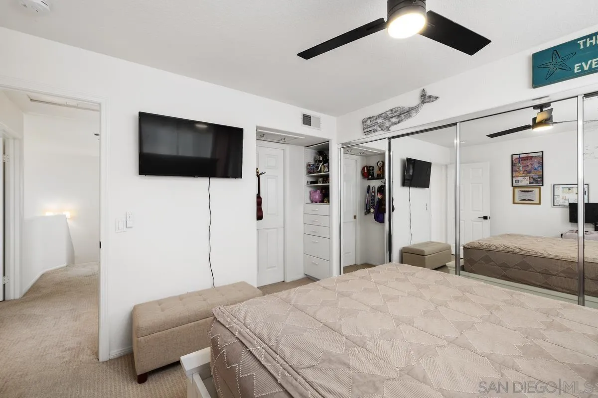 2259 Rolling Ridge Road Chula Vista, CA 91914 - Photo 42 of 52 a bedroom with a bed and a flat screen tv
