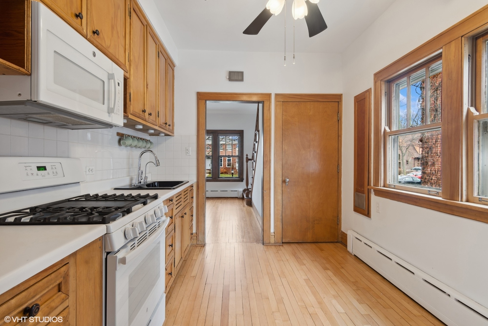 222 North Merrill Street Park Ridge, IL 60068 - Photo 7 of 20 a kitchen with stainless steel appliances granite countertop a stove and a refrigerator
