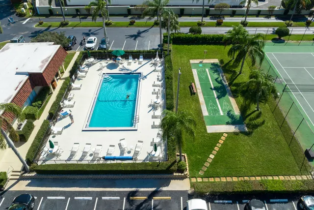 an aerial view of a residential houses with outdoor space