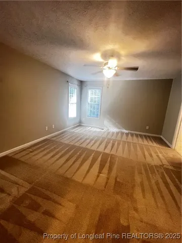 a view of a livingroom with a ceiling fan
