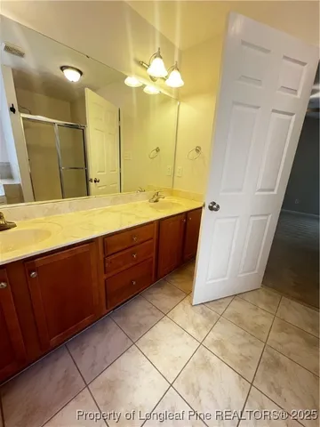 a bathroom with a sink and a shower