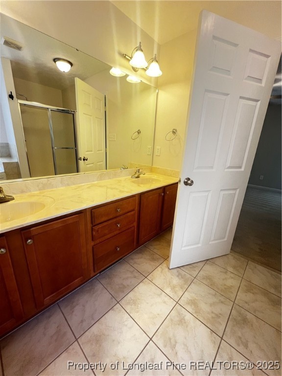 208 Wood Run Sanford, NC 27332 - Photo 17 of 29 a spacious bathroom with a double vanity sink a mirror and a bathtub