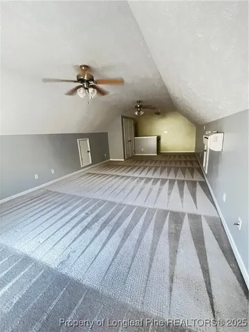 a bedroom with a bed and a lamp with window