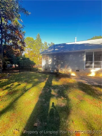 a view of a swimming pool with an outdoor space and seating area