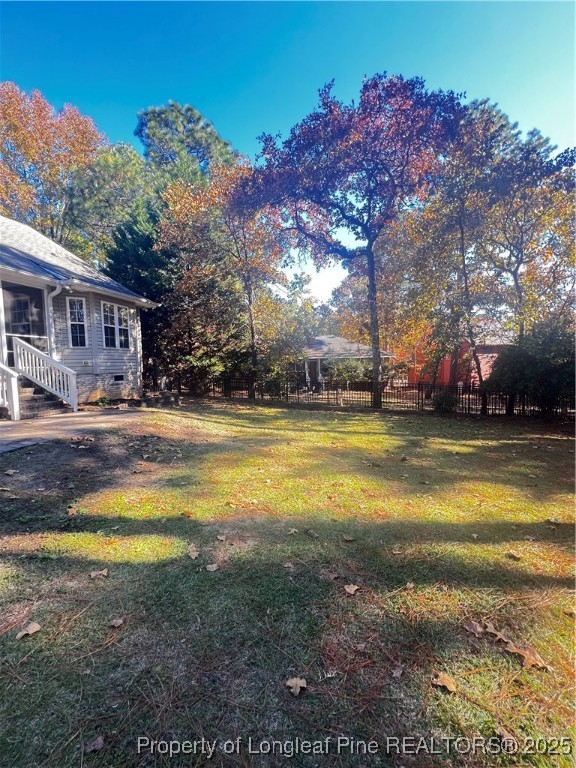 208 Wood Run Sanford, NC 27332 - Photo 28 of 29 a swimming pool view with a large trees in the background