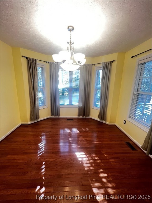 208 Wood Run Sanford, NC 27332 - Photo 6 of 29 a view of an empty room with window and wooden floor