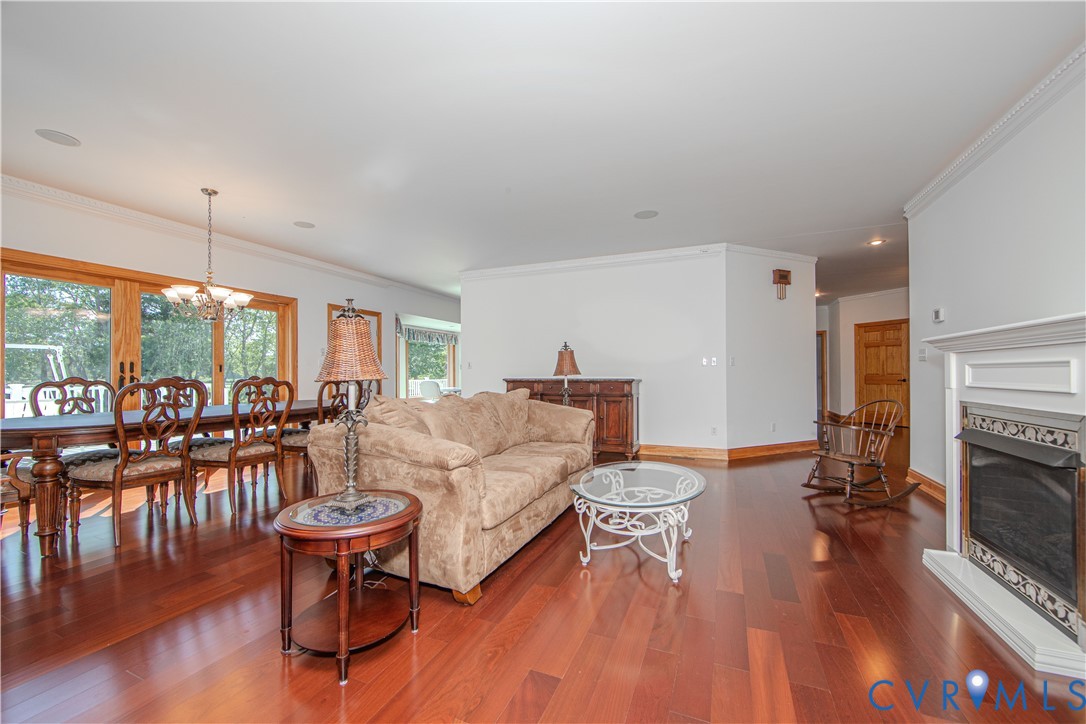 19220 Mink Farm Road Onancock, VA 23417 - Photo 12 of 50 a living room with furniture and a wooden floor