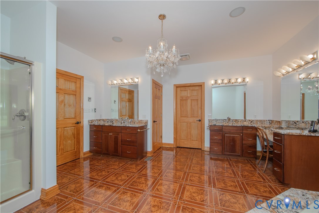 19220 Mink Farm Road Onancock, VA 23417 - Photo 22 of 50 a spacious bathroom with a tub sink and glass door