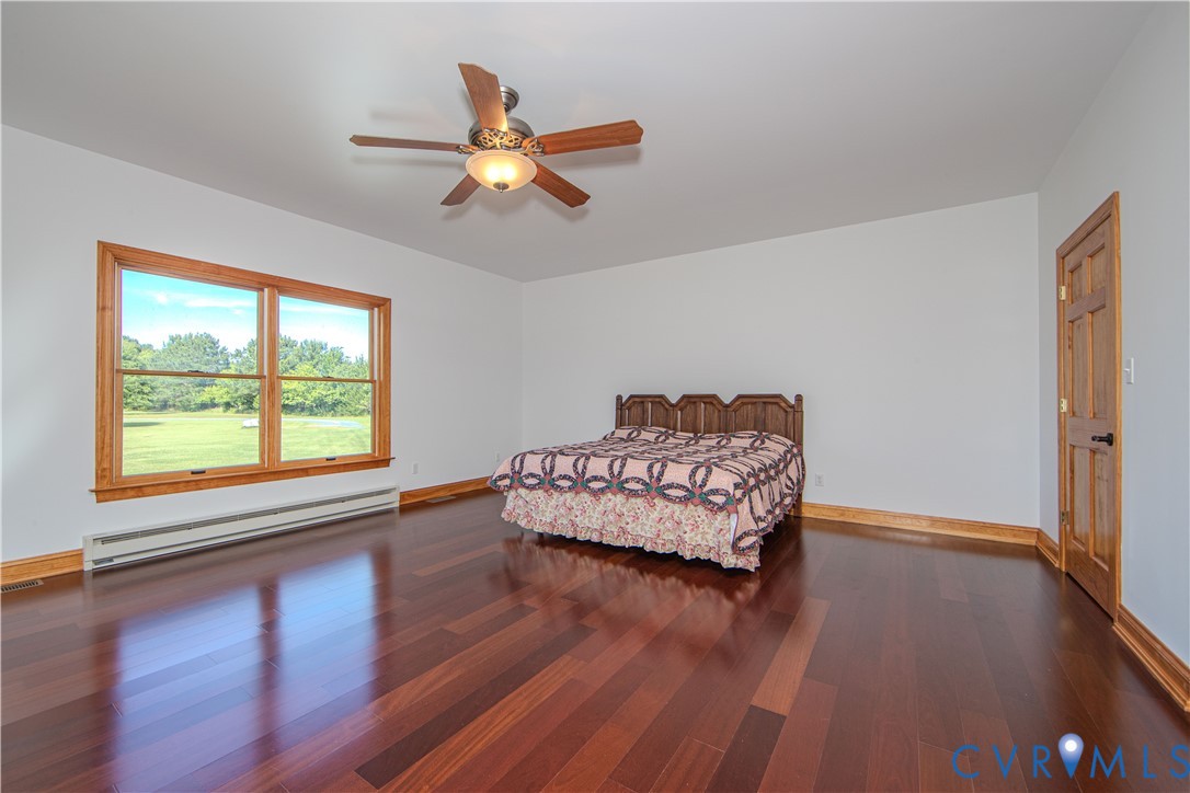 19220 Mink Farm Road Onancock, VA 23417 - Photo 28 of 50 a living room with hard wood floors and a window